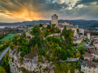 Aerial view of Arrone medieval hilltop village with castle in Valnerina valley Umbria Italy Dramatic sunset sky
