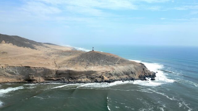 Aerial view of the coast of Eten, Lambayeque in northern Peru, with the lighthouse overlooking the Pacific Ocean and the arid coastal landscape in summer