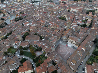 Aerial view of Arezzo medieval town center Piazza Grande, palaces, gothic churches Santa Maria della Pieve