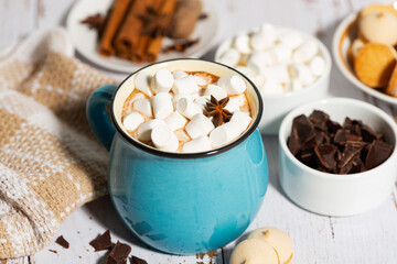 hot chocolate with marshmallows in a mug and cookies