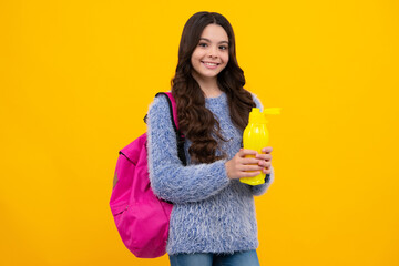 Back to school. Schoolgirl with bottle of water. Drinking regime. Teenager student. Happy teenager, positive and smiling emotions of teen schoolgirl.