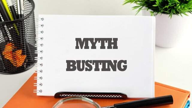 Myth busting word concept. Business concept. Animation of the MYTH BUSTING conceptual text in the notebook, the front view is on a blank sheet