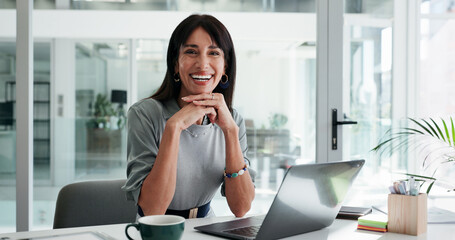 Obraz premium Portrait, woman and smile in office with laptop for public relations, career development or pride. Confident, mature person and happy in workplace with computer, brand management or job satisfaction.