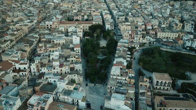 Cinematic aerial over Via Don Luigi Sturzo Castellammare del Golfo after sunset