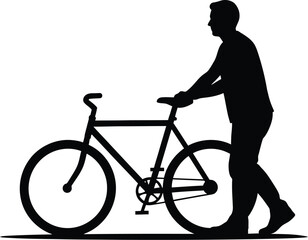 Silhouette of a man walking beside his bicycle