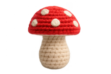 Hand knitted red mushroom amigurumi toy on transparent background