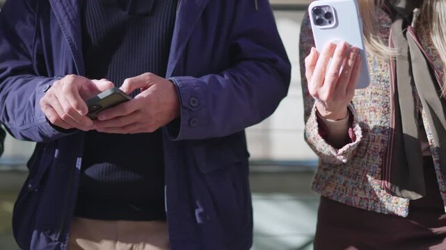 Seniors using their mobile phones outdoors