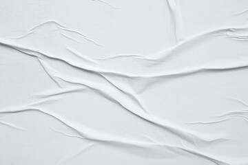 white crumpled and creased glued wrinkled paper poster texture background