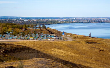 The holy spring of the Fedorov Icon of the Mother of God of Kashpirsky on the banks of the Volga River against the backdrop of the city of Syzran.