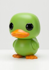 Green duck figurine with orange beak and feet on white background
