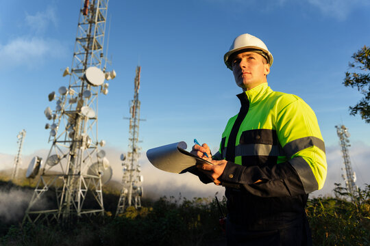 Engineer inspecting communication towers for 5G and 6G network deployment
