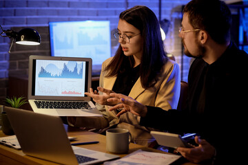 Business analysts working with laptop at table in office. Data science concept