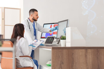 Young doctors analyzing scientific data at desk in laboratory