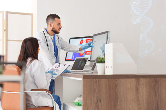 Young doctors analyzing scientific data at desk in laboratory - Powered by Adobe