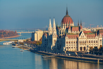 Naklejka premium Budapest cityscape, panoramic view of city and Danube River, Parliament building with Margit bridge and beautiful architecture in autumn season