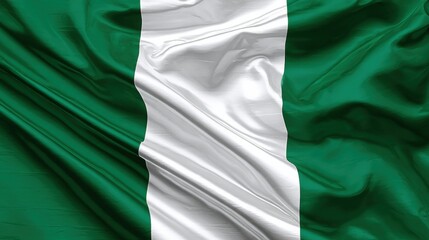 Obraz premium Waving flag of Nigeria displayed in folds with green and white colors during daylight hours showcasing national pride