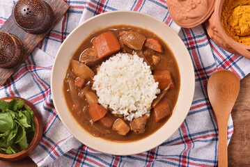 Pork curry with rice in a bowl