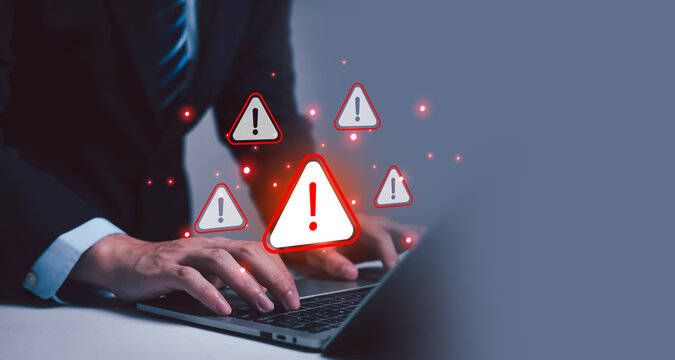 Cyber ​​attack alert on laptop. Cyber ​​attack on computer network. Virus, spyware, malware or malicious software. Businessman background.  - Powered by Adobe