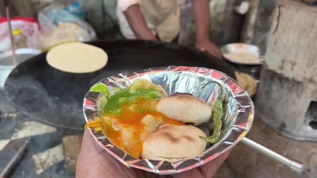 Litti chokha with chutney prepared in a roadside shop in Kolkata, India