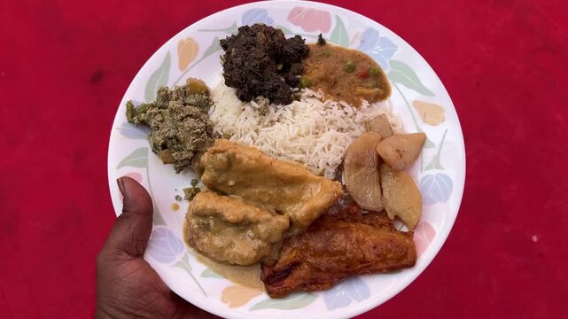 Bengali wedding food, which includes rice, shukto, dal fry, fish, saag.