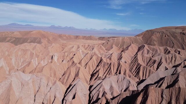 San Pedro de Atacama, Chile: Aerial drone footage of rock formation in Devil Throat canyon in San Pedro de Atacama, Chile on sunny day. Taken with forward motion