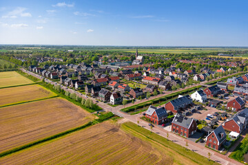 Scenic landscape of Luttelgeest village in the middle of the fields in The Netherlands, established...