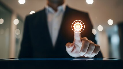 Businessman Touching Futuristic Gear Icon Symbolizing Innovation and Technology.
