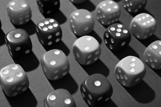 Colorful game dices on green background, closeup