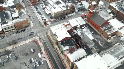 Aerial drone video of a city block after a fire burnt down businesses and homes. - Powered by Adobe