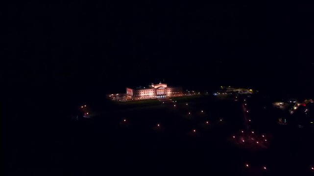 Ultra-wide 4K 60fps aerial video of the Stormont Parliament Buildings in Belfast, Northern Ireland on a calm, quiet night. Produced in broadcast standard Rec709 color space.