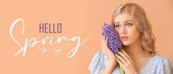 Beautiful young woman with hyacinth flowers and text HELLO, SPRING on orange background © Pixel-Shot