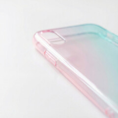 Close-up of Translucent Pink and Blue Gradient Phone Case on White Background