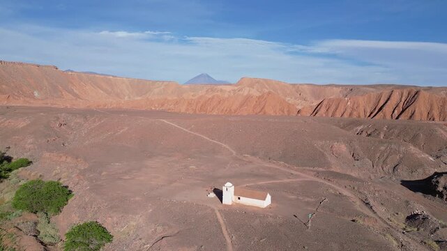San Pedro de Atacama, Chile: Aerial footage of San Isidro church in the middle of Catarpe valley, San Pedro de Atacama, Chile. Taken with backward and upward motion showing the Licancabur volcano
