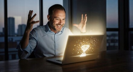 Happy man celebrating online victory with glow from laptop screen displaying winning trophy and confetti. Business success concept for remote work.