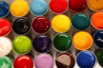Gouache colorful paints set. Jars of gouache paint isolated on a white background.