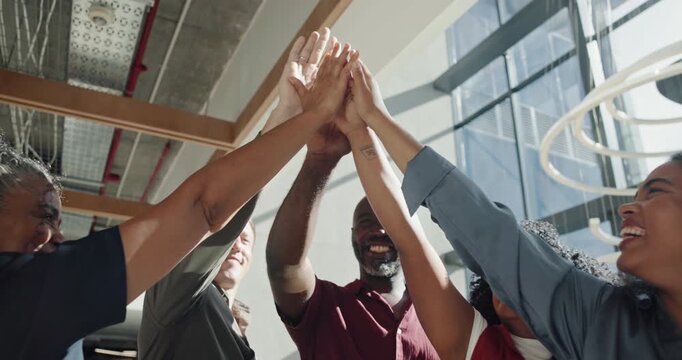 Happy, business people and teamwork with high five for winning, unity or solidarity in workplace. Excited, group or employees with trust, support or hands together in air for done or mission success