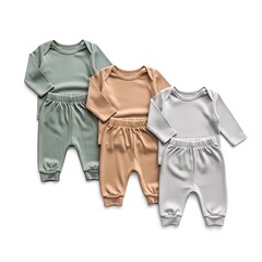 Obraz premium Three sets of soft long-sleeved baby bodysuits and matching pants in green, beige, and grey, neatly arranged on a white background.