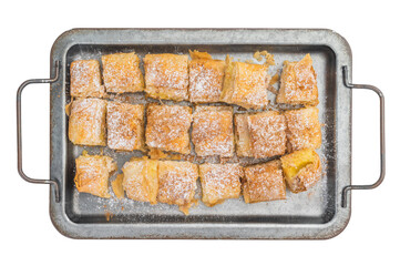 Sweet filo pastry dessert with creamy custard filling dusted with powdered sugar baked and cut into squares top view