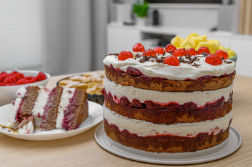 Homemade chocolate and cherry birthday cake, chocolate sponge cake layered with cherry jam and cream