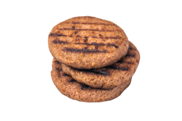 Grilled plant based burger patty vegan meat alternative with grill marks isolated on white background top view