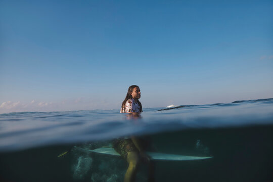 Man Surfer Sitting On Surfboard, Split Shot