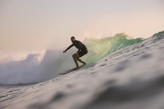 Early Surfing Calm, Surfer Enjoying Early Morning Waves