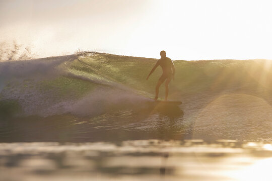 urfer Riding Sunset Wave Silhouetted Longboard