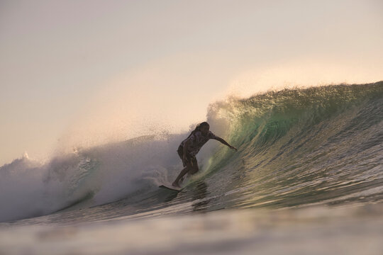 Early Surfing Calm, Surfer Enjoying Early Morning Waves