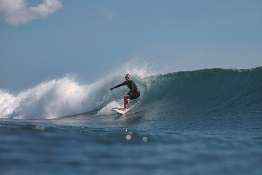 Surfer Committing To Steep DropIn On Fast Face