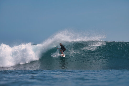 Surfer Threading Narrow Tubular Wave