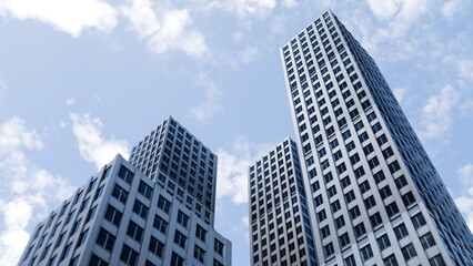 Naklejka premium group of tall buildings stands in an urban area under a blue sky with clouds. People may be walking nearby as the sun shines down on the city. 3d render
