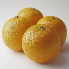 Four ripe oranges clustered, with textured peel, close-up