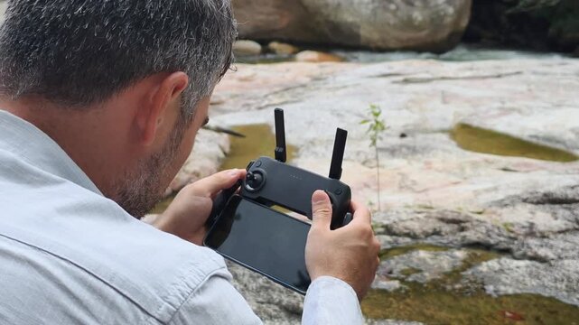 Digital nomad lifestyle and remote work in wild. Man explores digital nomad lifestyle and remote work in wild. Modern digital nomad lifestyle and remote work near river.