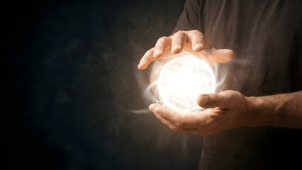 Hands Holding Bright Glowing Light Orb.